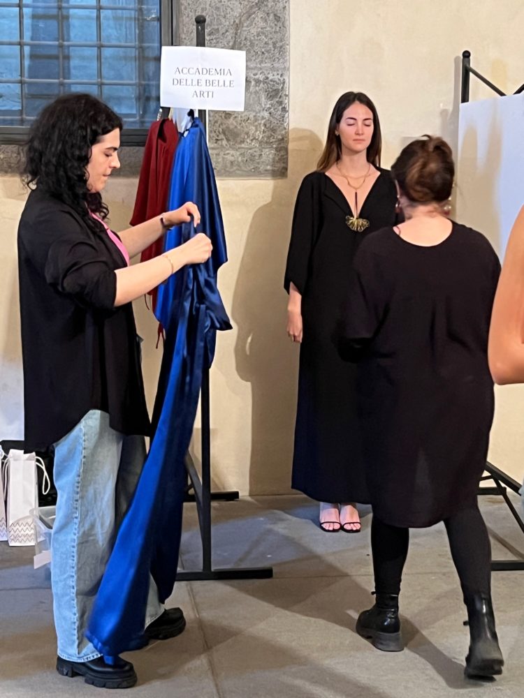 Some moments from the fitting for the EVALab fashion show at Napoli Moda Design. Seen from behind, on the left: Carmela Amodeo, stylist of EVALab, and on the right: Maddalena Marciano, lecturer in Fashion Design at the Academy of Fine Arts in Naples, design supervisor of EVALab.